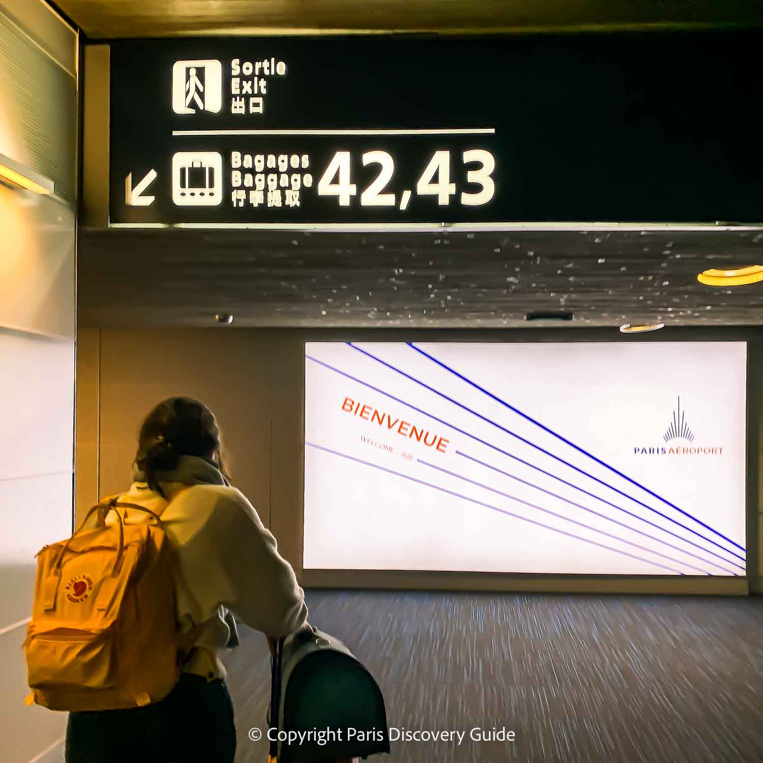 Welcome (Bienvenue) sign in the Arrivals area at CDG Airport
